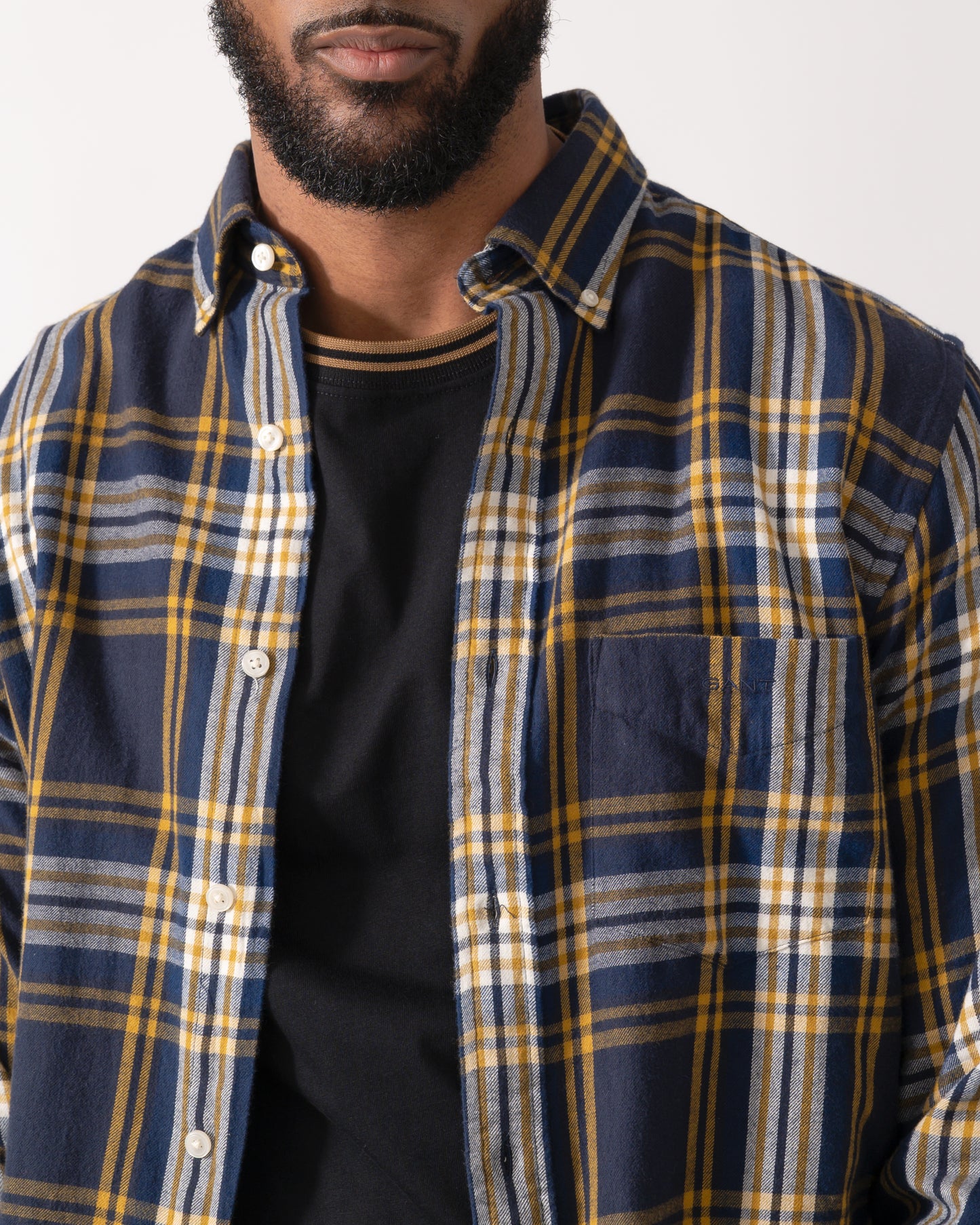 close up of a model wearing a GANT Mens Long Sleeve Windblown Flannel Large Check Shirt in Evening Blue