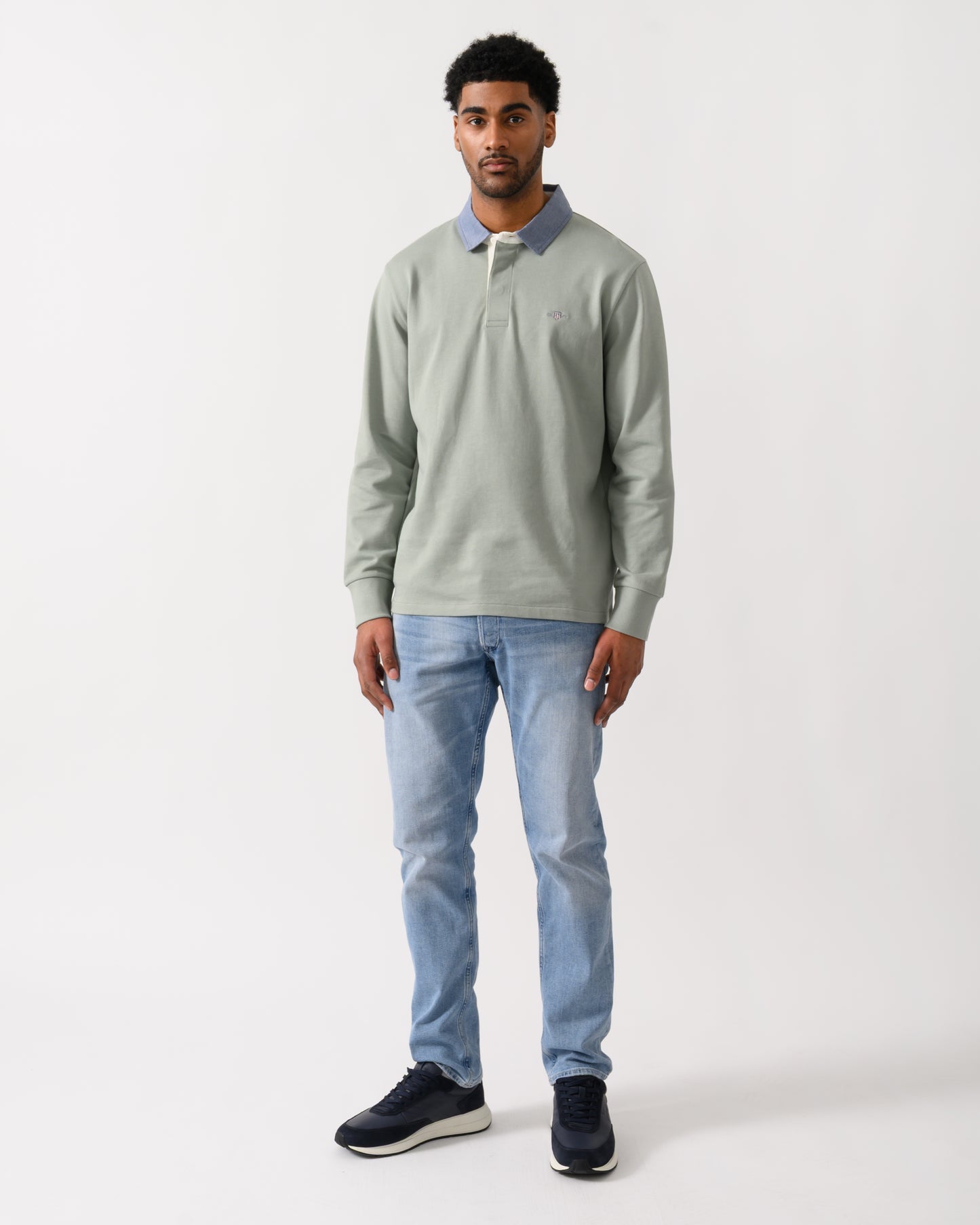 full length view of a model wearing a GANT Mens Regular Chambray Heavy Rugger in 10 Ceramic Grey