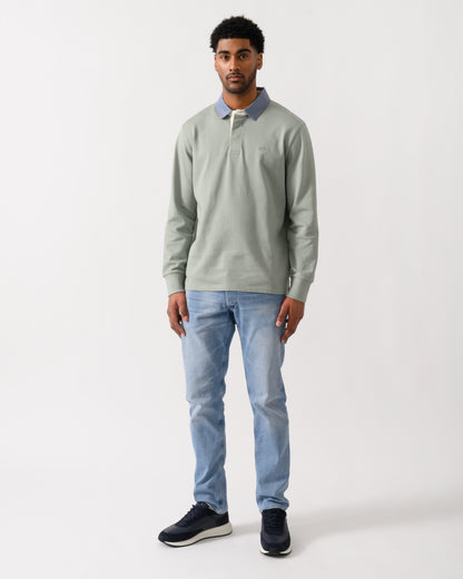 full length view of a model wearing a GANT Mens Regular Chambray Heavy Rugger in 10 Ceramic Grey