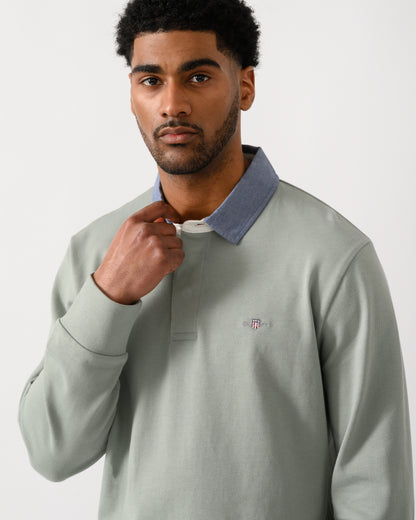 detail view of a model wearing a GANT Mens Regular Chambray Heavy Rugger in 10 Ceramic Grey