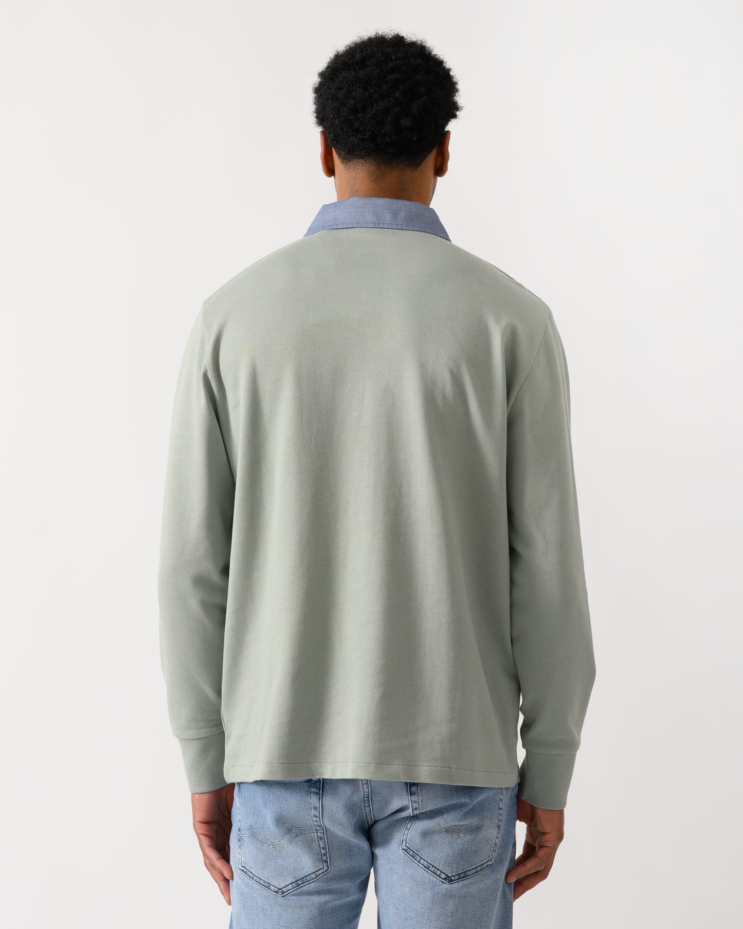 back view of a model wearing a GANT Mens Regular Chambray Heavy Rugger in 10 Ceramic Grey