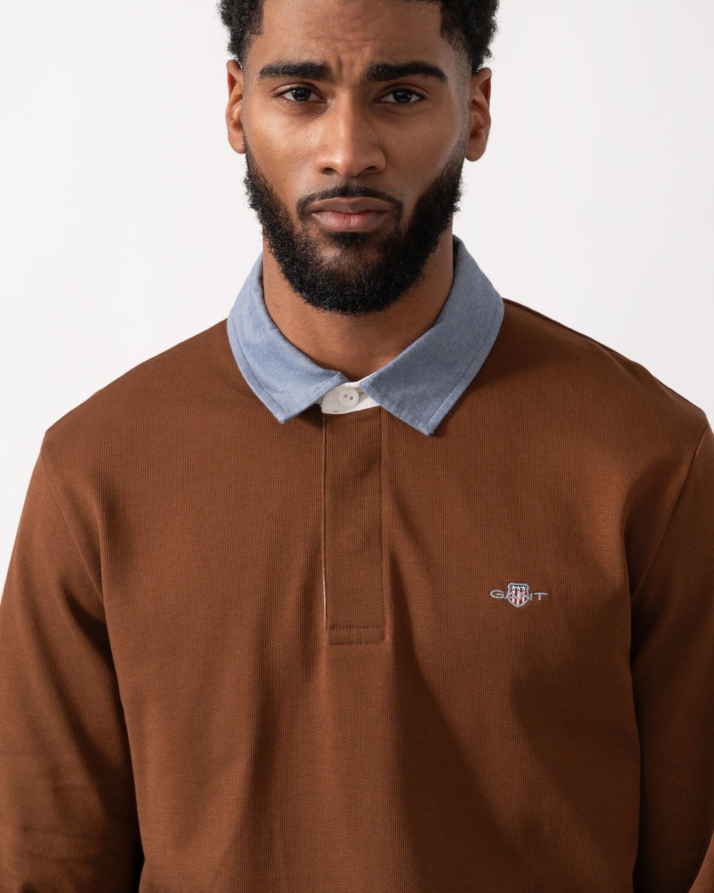 close up of a Model wearing s GANT Mens Regular Fit Chambray Heavy Rugger in Mahogany Brown