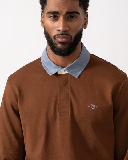 close up of a Model wearing s GANT Mens Regular Fit Chambray Heavy Rugger in Mahogany Brown
