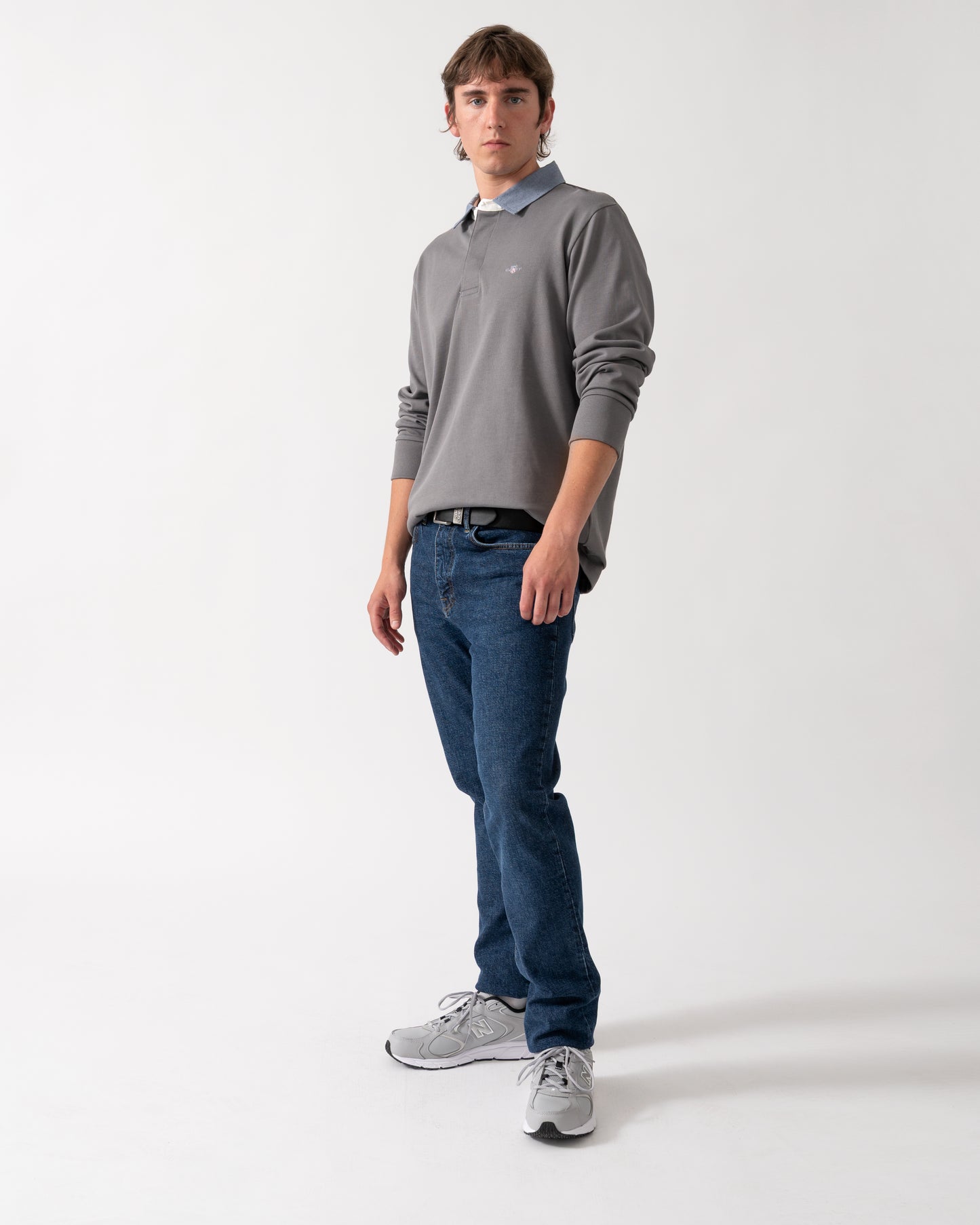 full length shot of a model wearing a GANT Mens Regular Fit Chambray Heavy Rugger in 38 Mid Grey