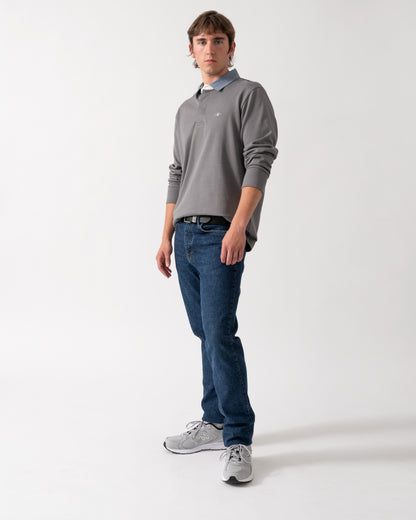full length shot of a model wearing a GANT Mens Regular Fit Chambray Heavy Rugger in 38 Mid Grey