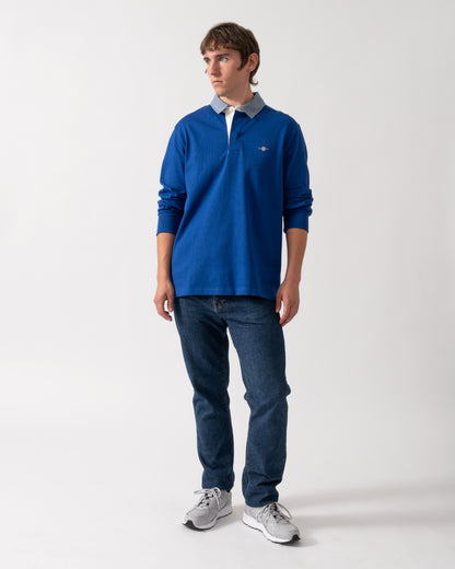 full length shot of a model wearing a GANT Mens Regular Fit Chambray Heavy Rugger in 435 Crisp Blue