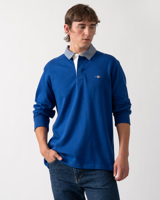 model wearing a GANT Mens Regular Fit Chambray Heavy Rugger in 435 Crisp Blue