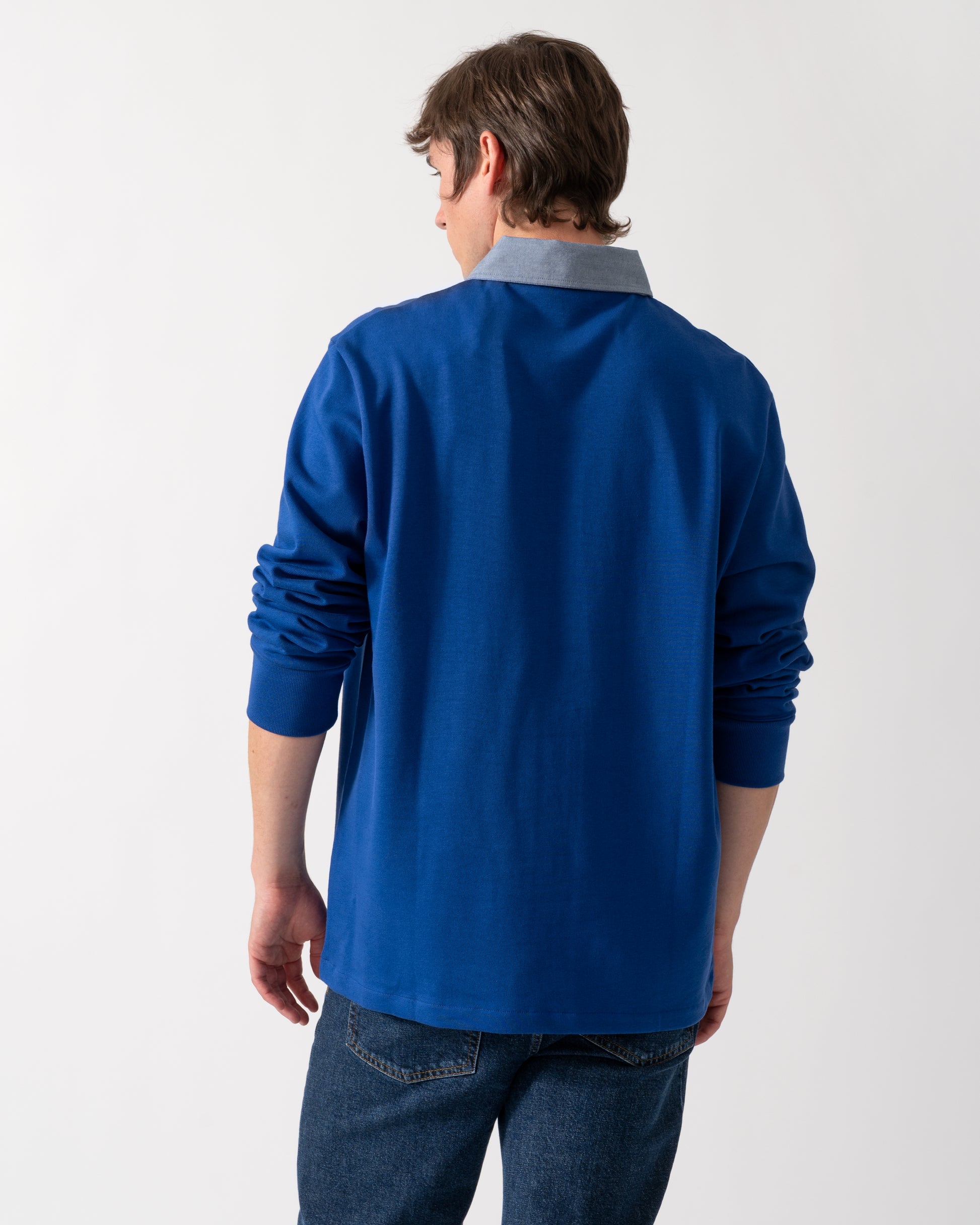back shot of a model wearing a GANT Mens Regular Fit Chambray Heavy Rugger in 435 Crisp Blue