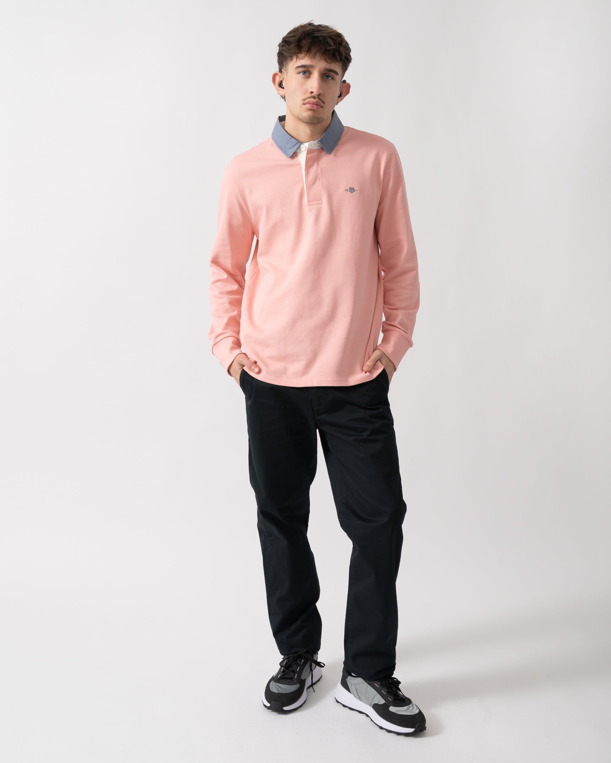 full length shot of a model wearing a GANT Mens Regular Fit Chambray Heavy Rugger in Bubblegum Pink