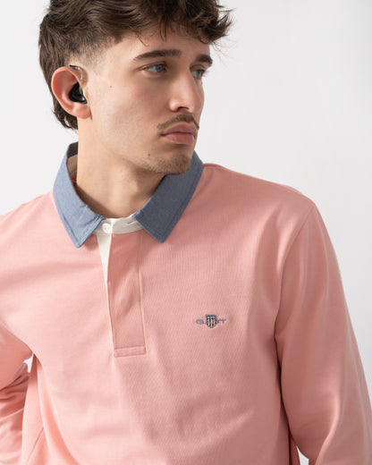 close up shot of a model wearing a GANT Mens Regular Fit Chambray Heavy Rugger in Bubblegum Pink