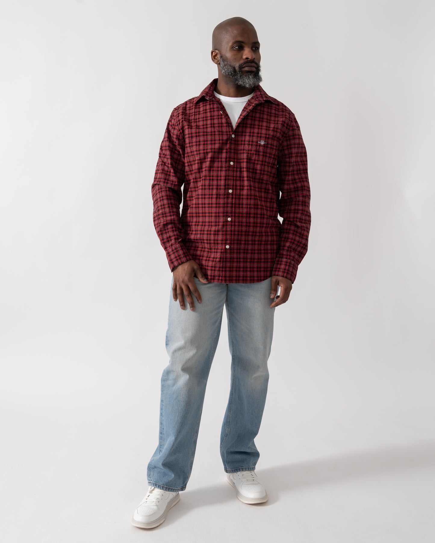 full length shot of a Model wearing a GANT Mens Regular Fit Classic Poplin Check Shirt in Ruby Red