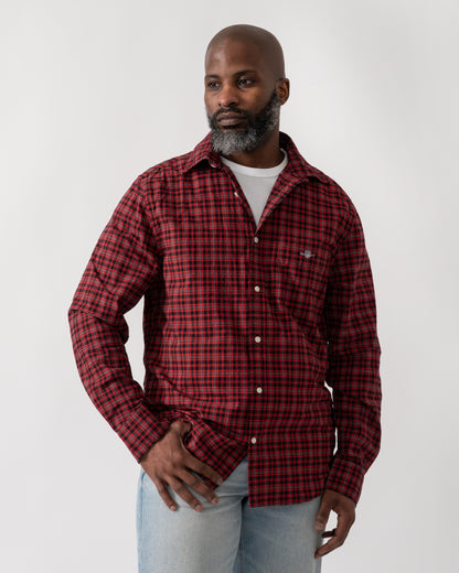 Model wearing a GANT Mens Regular Fit Classic Poplin Check Shirt in Ruby Red