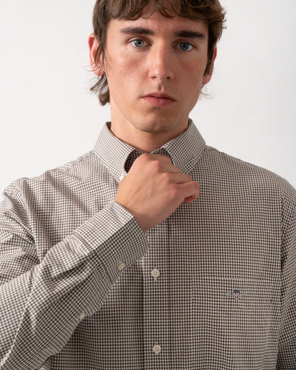 close up of model wearing a GANT Mens Regular Fit Classic Poplin Gingham Shirt in 260 Faded Taupe