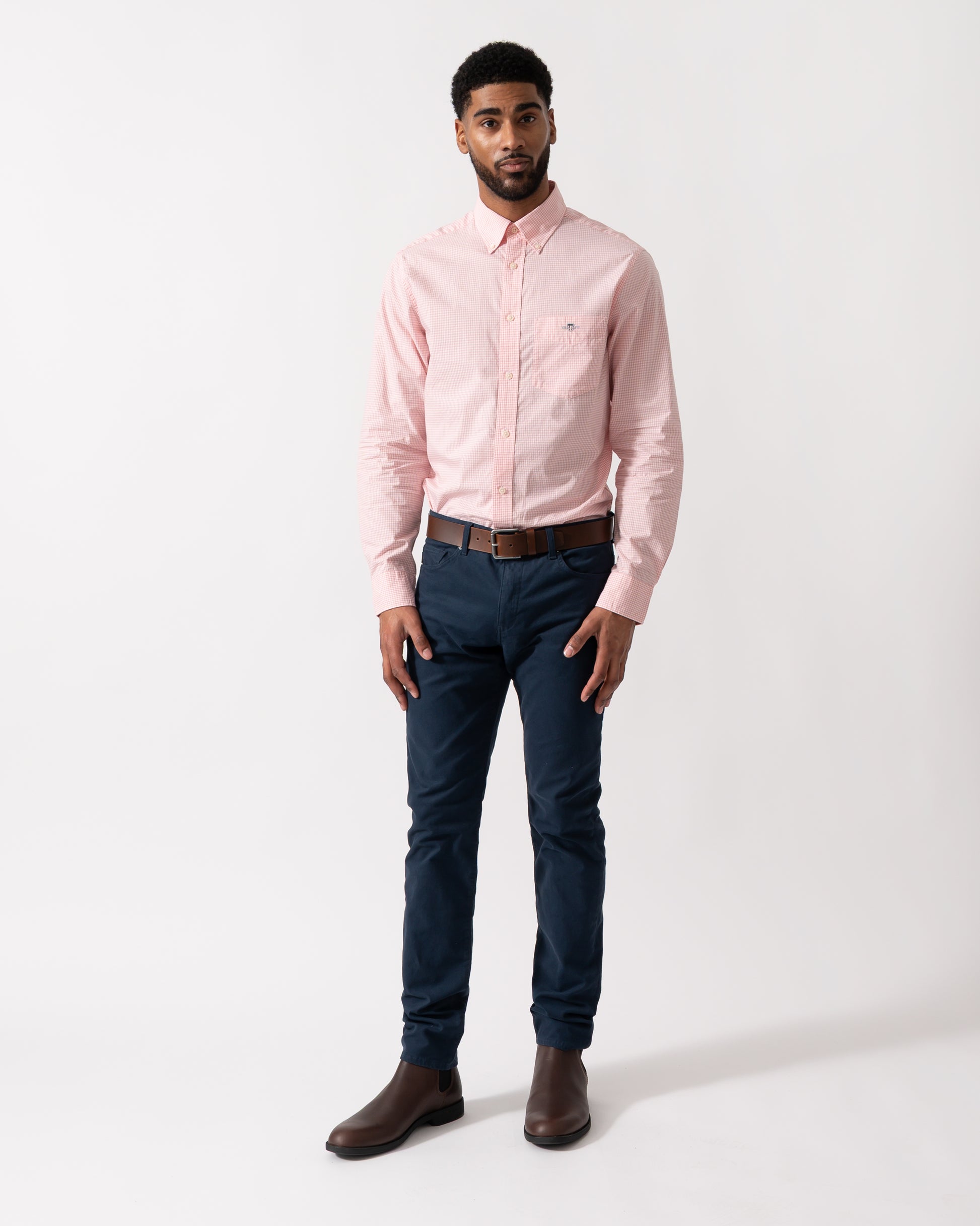 Full length shot of a Model wearing a GANT Mens Regular Fit Classic Poplin Gingham Shirt in Washed Pink