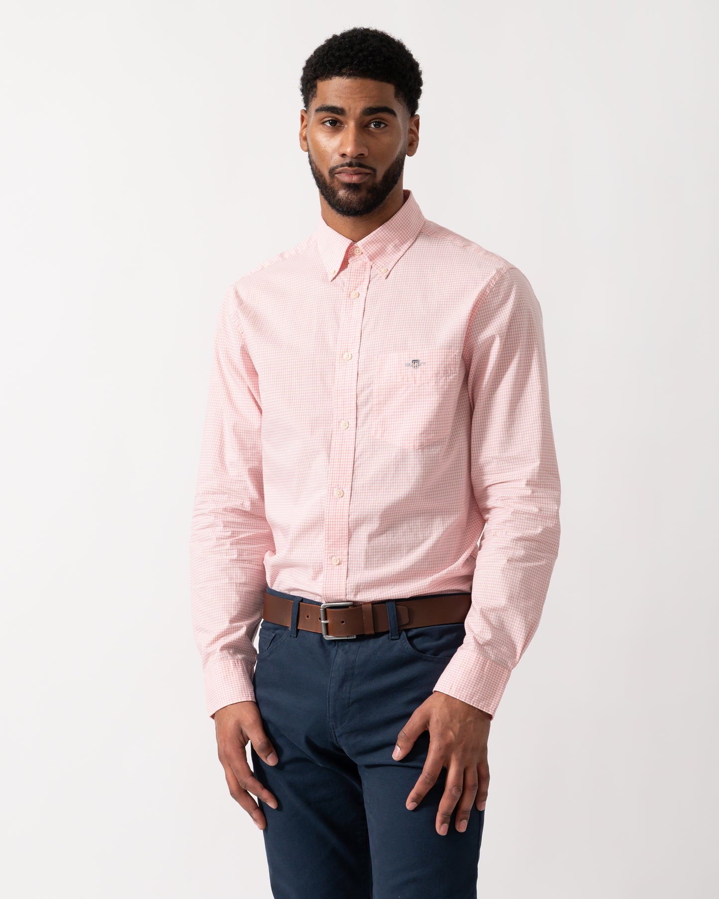 Model wearing a GANT Mens Regular Fit Classic Poplin Gingham Shirt in Washed Pink