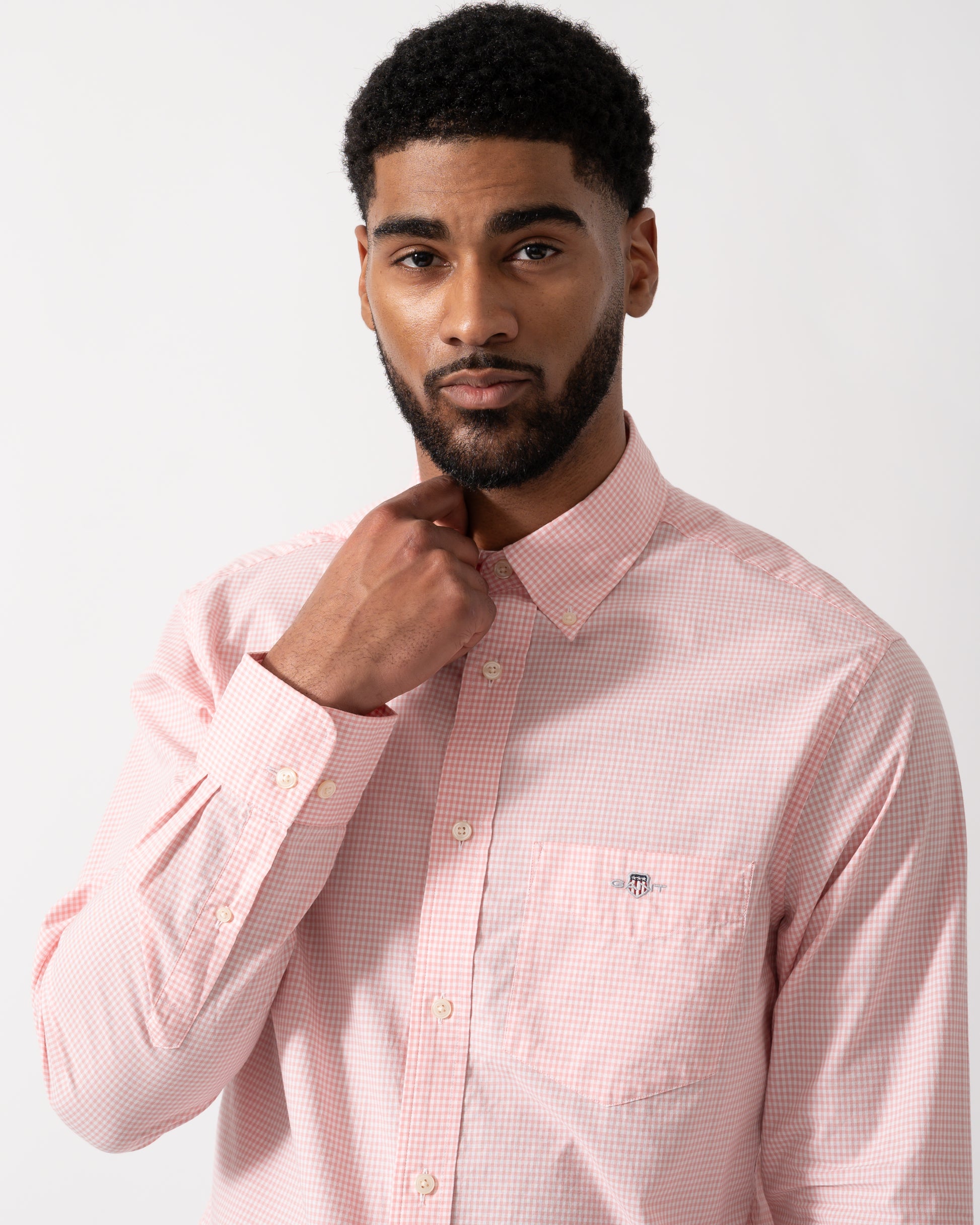 Detail shot of a Model wearing a GANT Mens Regular Fit Classic Poplin Gingham Shirt in Washed Pink