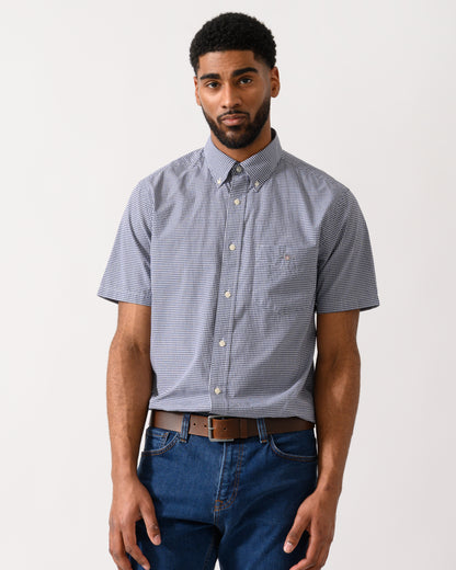 Model wearing a GANT Mens Regular Fit Classic Poplin Gingham Short Sleeve Shirt in Persian Blue