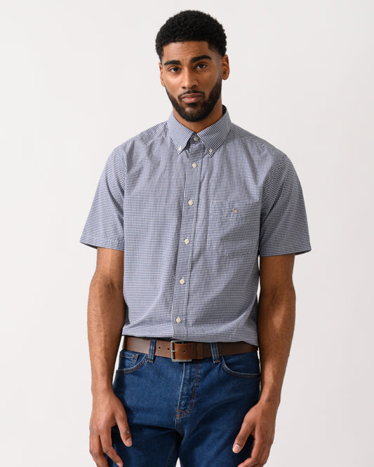 Model wearing a GANT Mens Regular Fit Classic Poplin Gingham Short Sleeve Shirt in Persian Blue