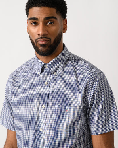 detail shot of a Model wearing a GANT Mens Regular Fit Classic Poplin Gingham Short Sleeve Shirt in Persian Blue
