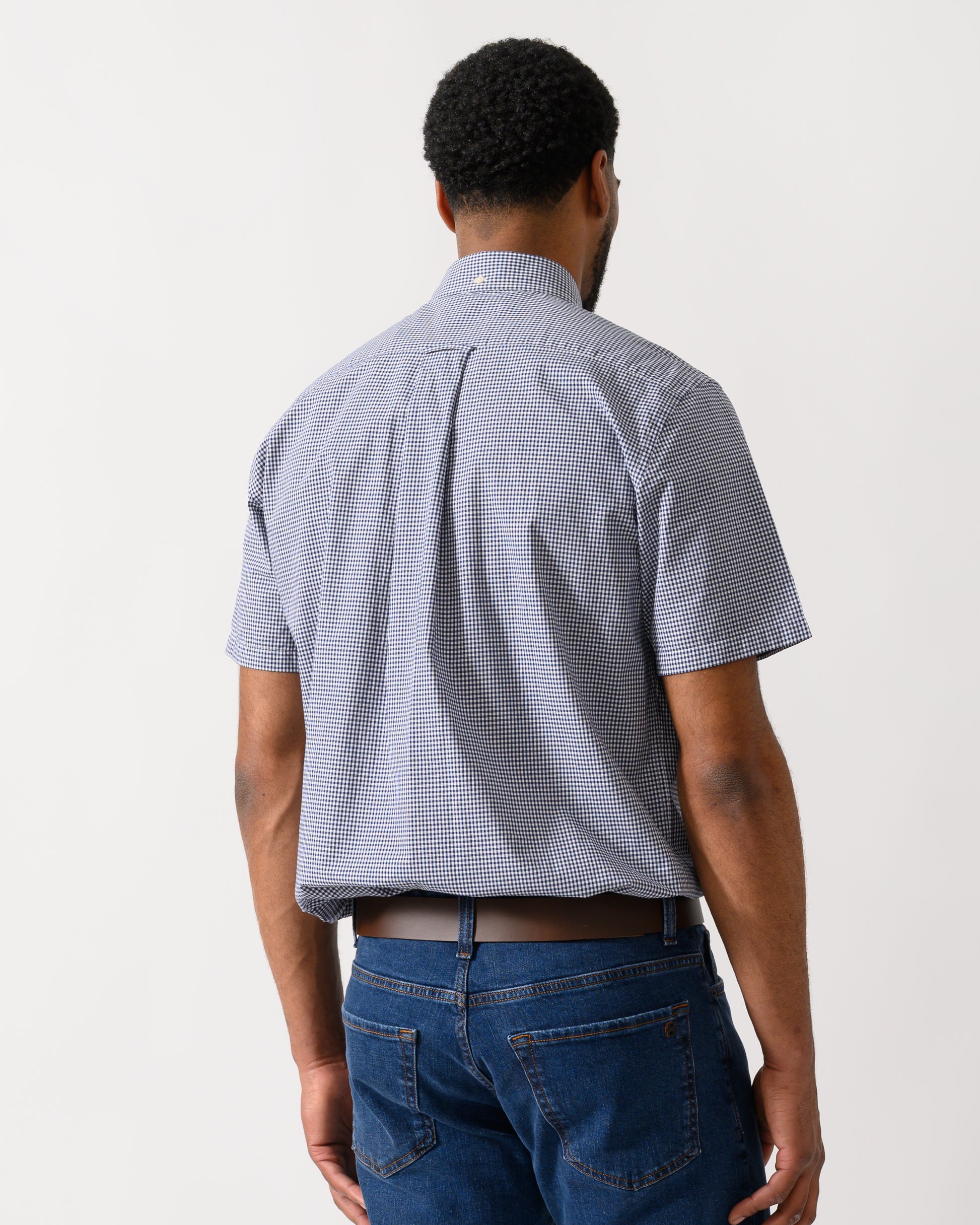 back shot of a Model wearing a GANT Mens Regular Fit Classic Poplin Gingham Short Sleeve Shirt in Persian Blue