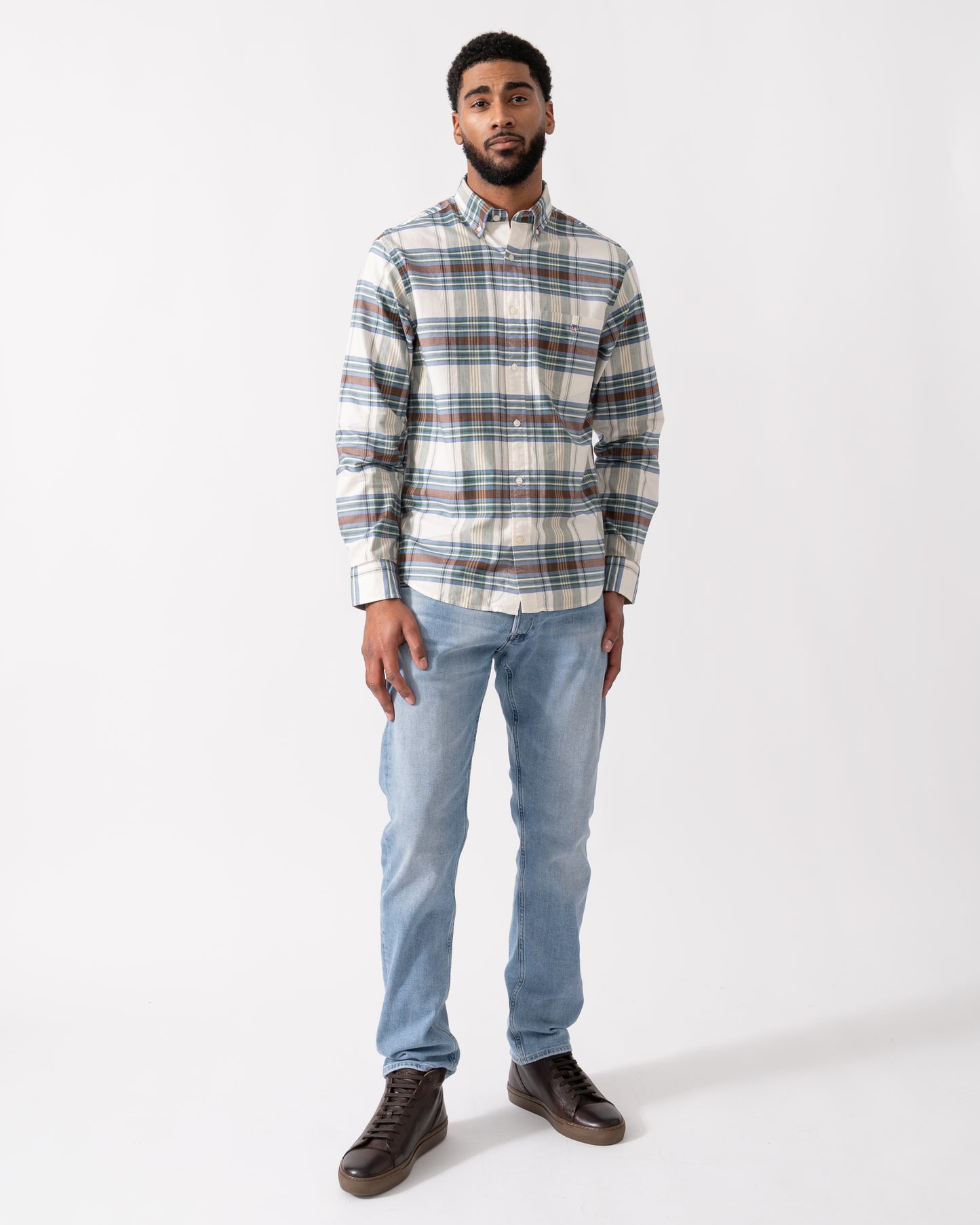 full length shot of a model wearing a GANT Mens Regular Fit Oxford Check Shirt in Woody Green