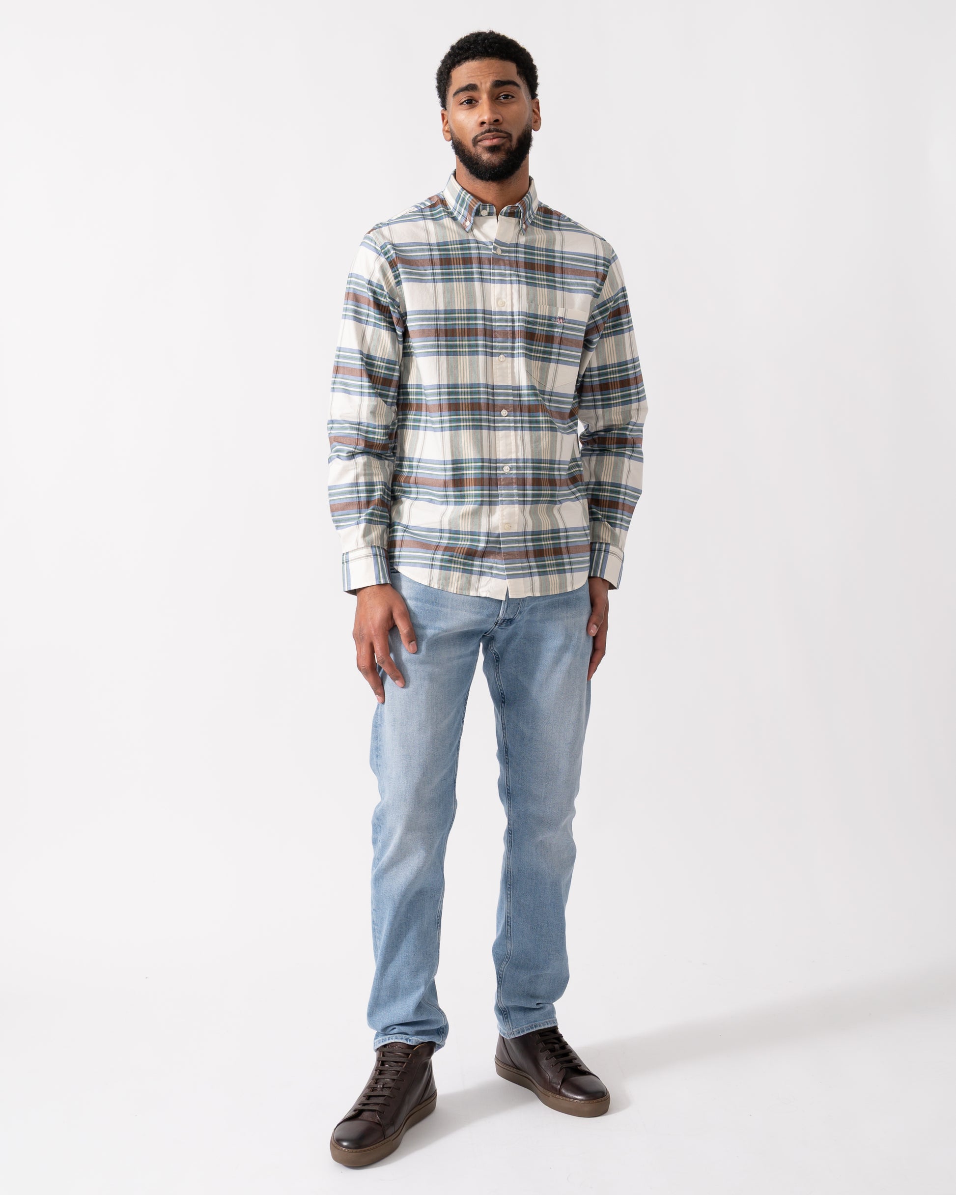 full length shot of a model wearing a GANT Mens Regular Fit Oxford Check Shirt in Woody Green