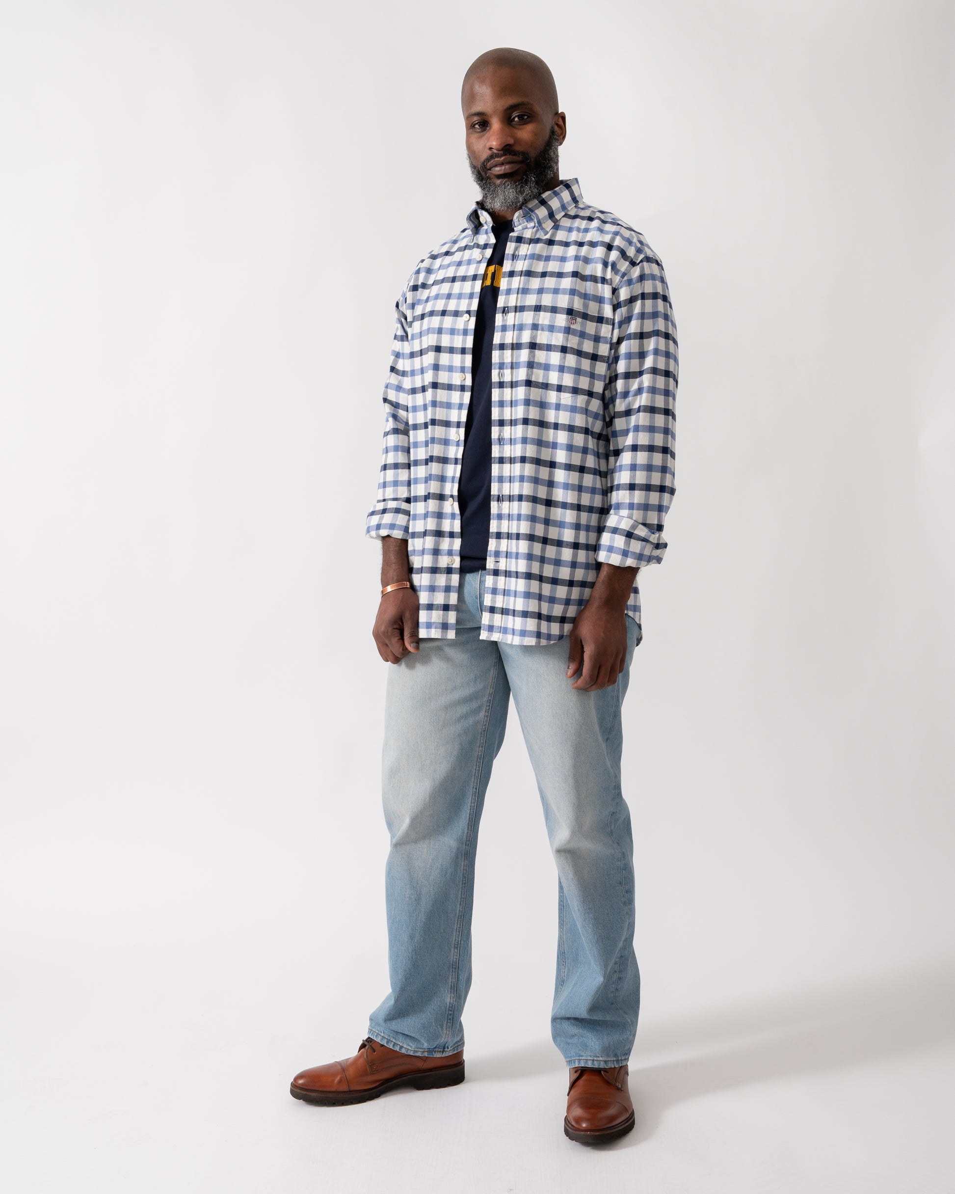 Full length shot of a Model wearing a GANT Mens Regular Fit Oxford Check Shirt in Faded Denim