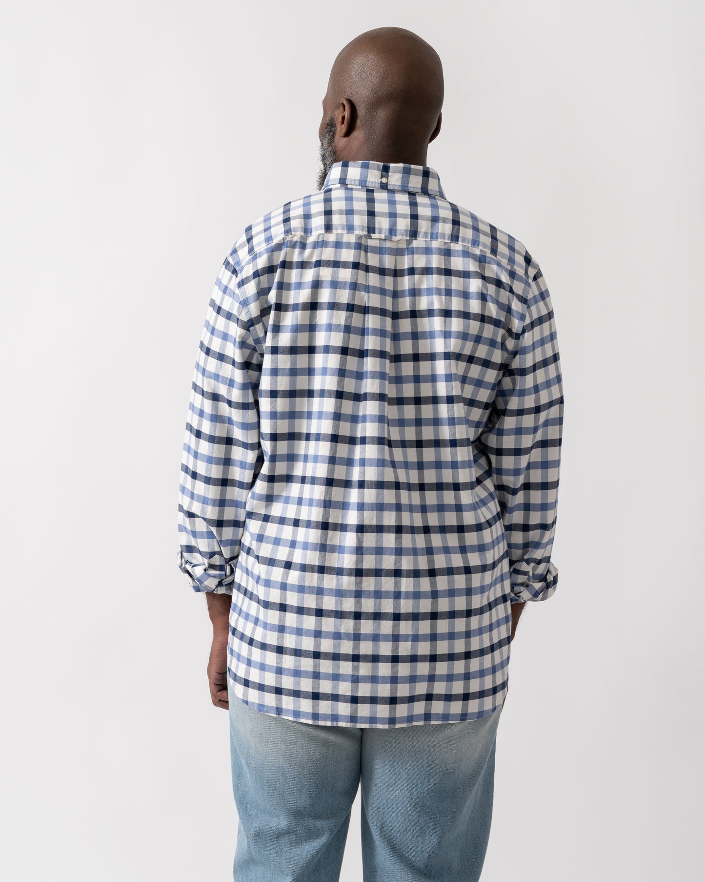 back shot of a Model wearing a GANT Mens Regular Fit Oxford Check Shirt in Faded Denim