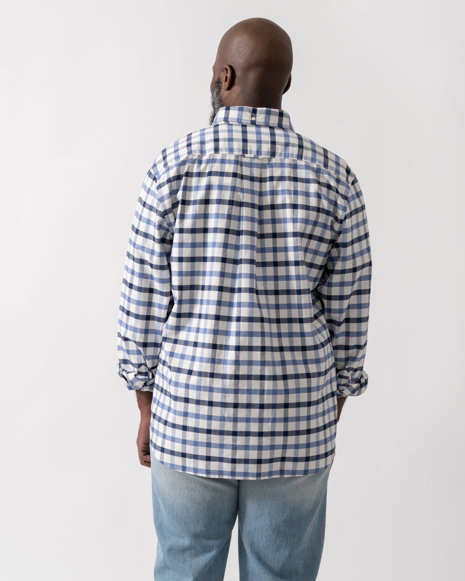 back shot of a Model wearing a GANT Mens Regular Fit Oxford Check Shirt in Faded Denim