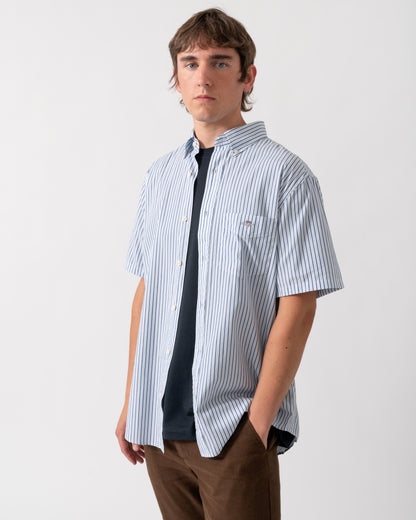 model wearing a GANT Mens Regular Fit Poplin Stripe Short Sleeve Shirt in 457 Fresh Blue