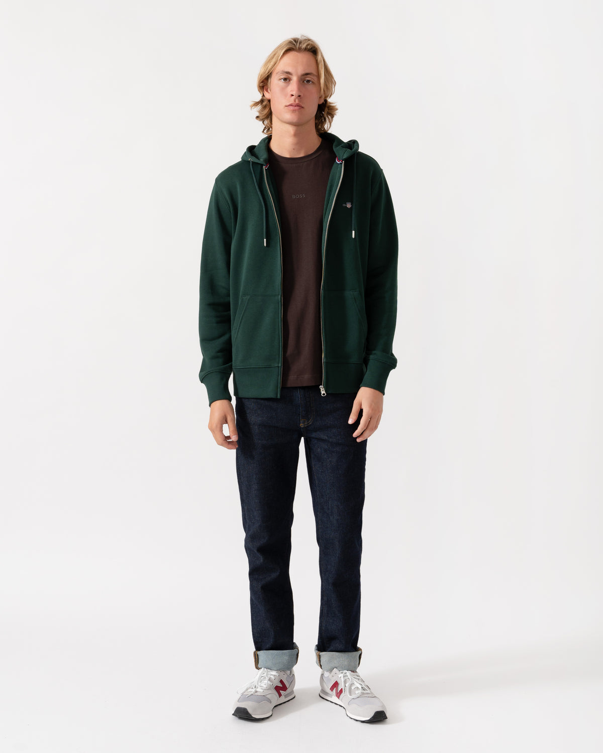 Model wearing the GANT Mens Regular Fit Shield Logo Full Zip Hoodie - 374 Tartan Green