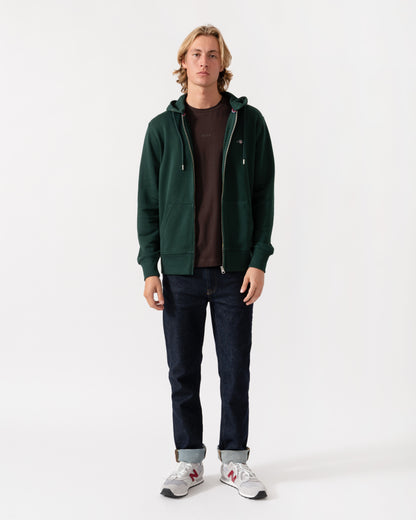 Model wearing the GANT Mens Regular Fit Shield Logo Full Zip Hoodie - 374 Tartan Green
