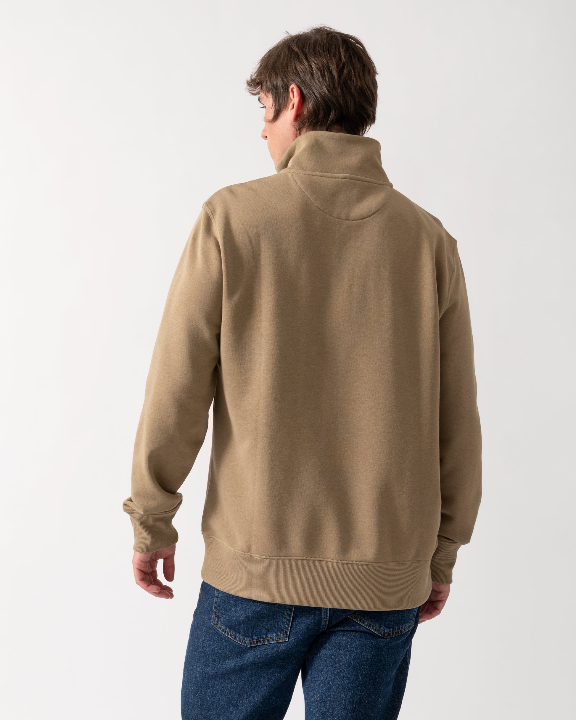 back shot of a model wearing a GANT Mens Regular Fit Shield Logo Half Zip Sweatshirt in 264 Light Taupe