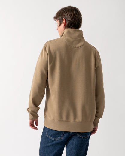 back shot of a model wearing a GANT Mens Regular Fit Shield Logo Half Zip Sweatshirt in 264 Light Taupe