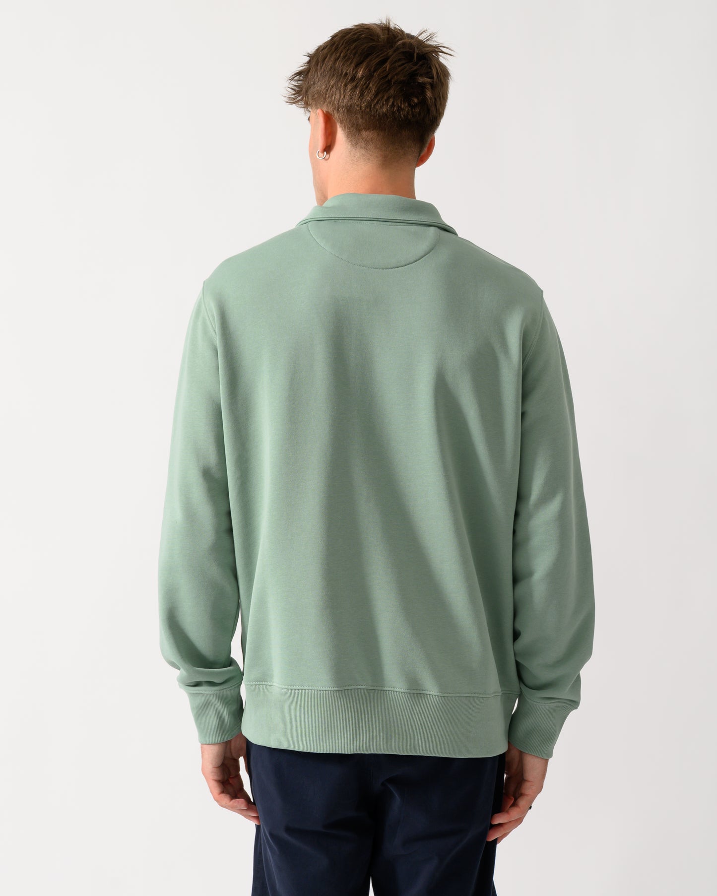 back shot of a model wearing a GANT Mens Regular Fit Shield Logo Half Zip Sweatshirt in 308 Surplus Mint