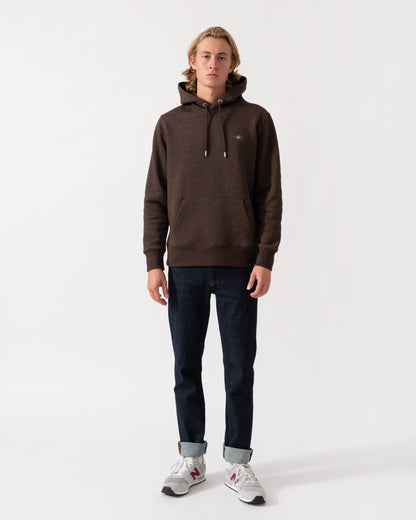 Model wearing the GANT Mens Regular Fit Shield Logo Pullover Hoodie - 284 Black Brown Melange
