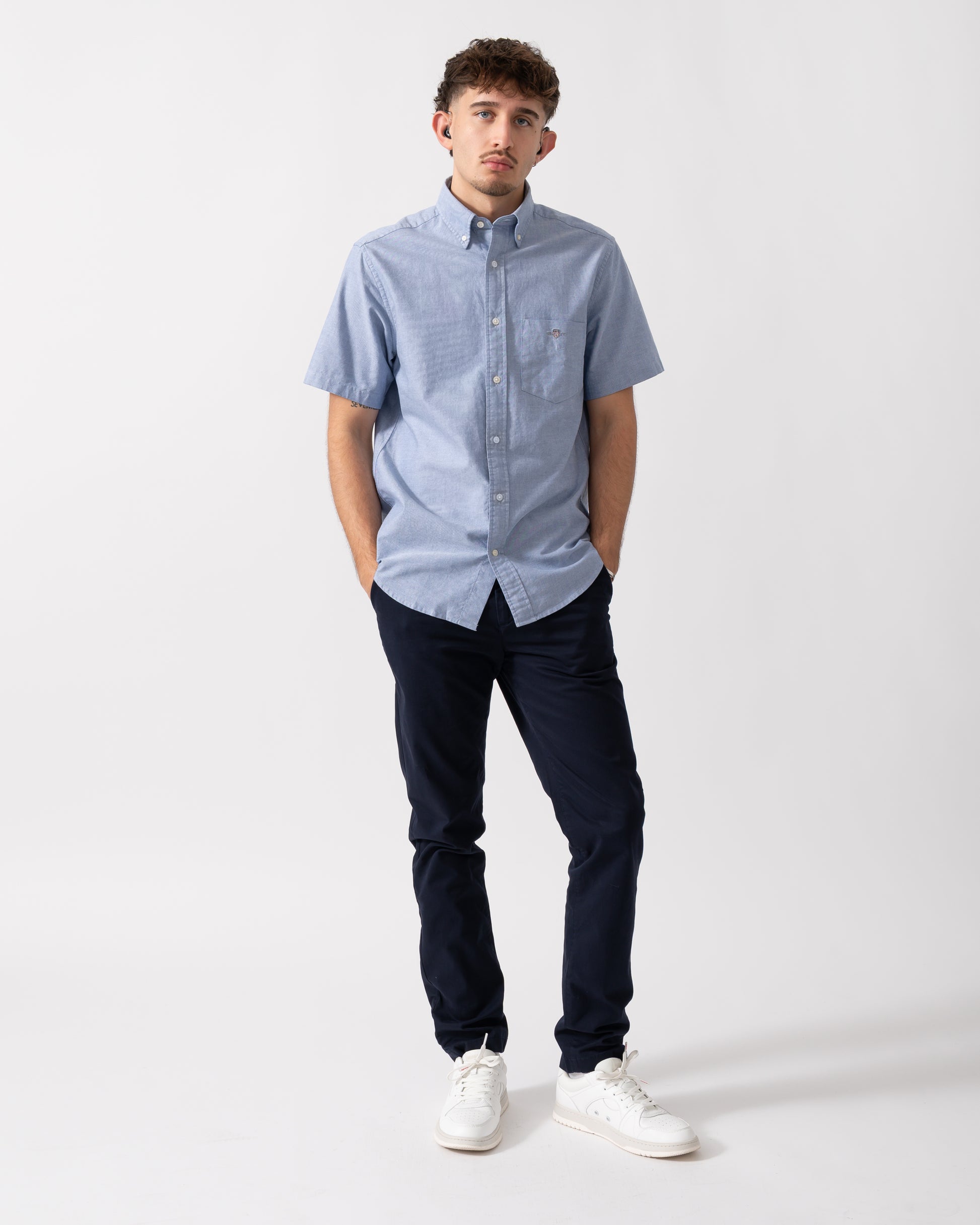 Full Length shot of a Model wearing a GANT Mens Regular Fit Short Sleeve Oxford Shirt in College Blue
