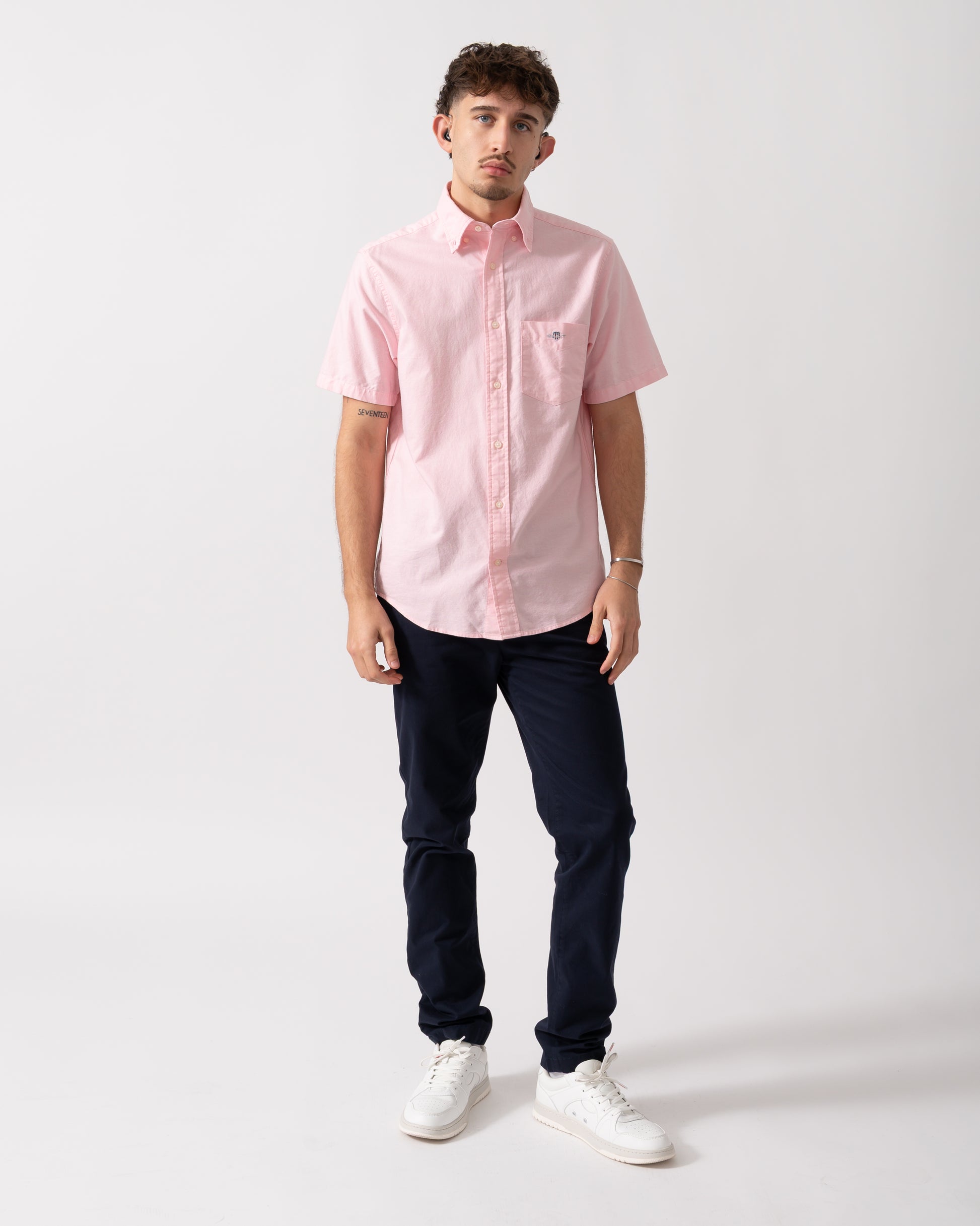 Full length shot of a Model wearing a GANT Mens Regular Fit Short Sleeve Oxford Shirt in Washed Pink