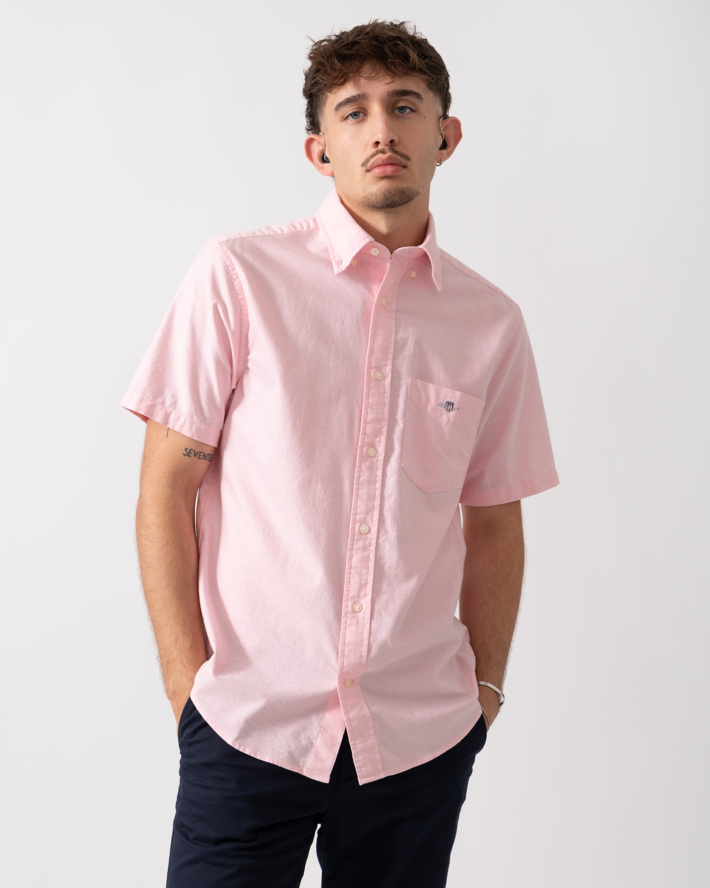Model wearing a GANT Mens Regular Fit Short Sleeve Oxford Shirt in Washed Pink