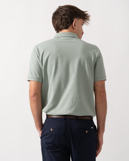 back shot of a Model wearing a GANT Mens Regular Fit Short Sleeve Shield Logo Pique Polo in Ceramic Grey