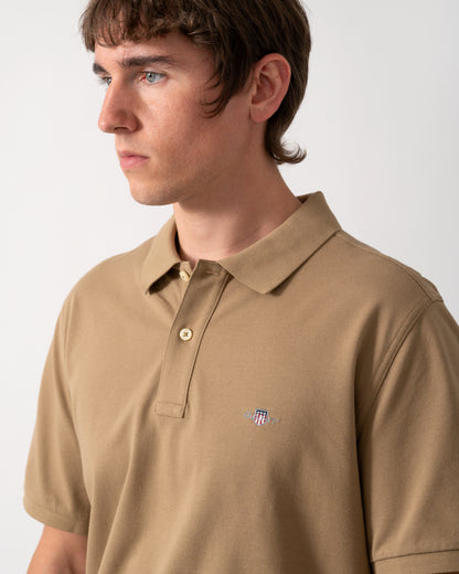 close up of GANT Mens Regular Fit Short Sleeve Shield Logo Pique Polo in 264 Light Taupe