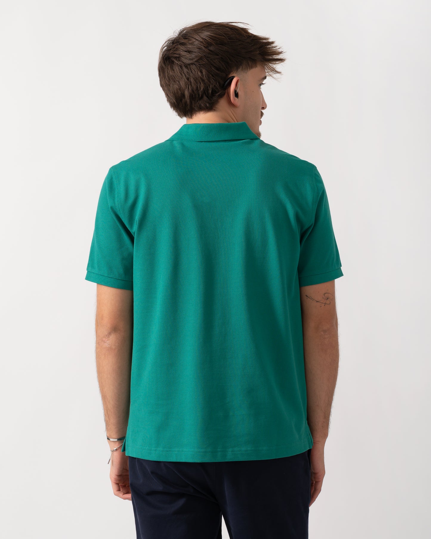 Back shot of a Model wearing a GANT Mens Regular Fit Short Sleeve Shield Logo Pique Polo in Botanical Hue