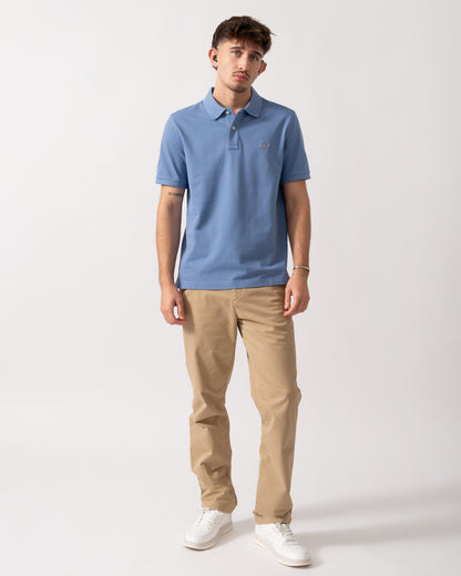 Full length shot of a Model wearing a GANT Mens Regular Fit Short Sleeve Shield Logo Pique Polo in Faded Denim