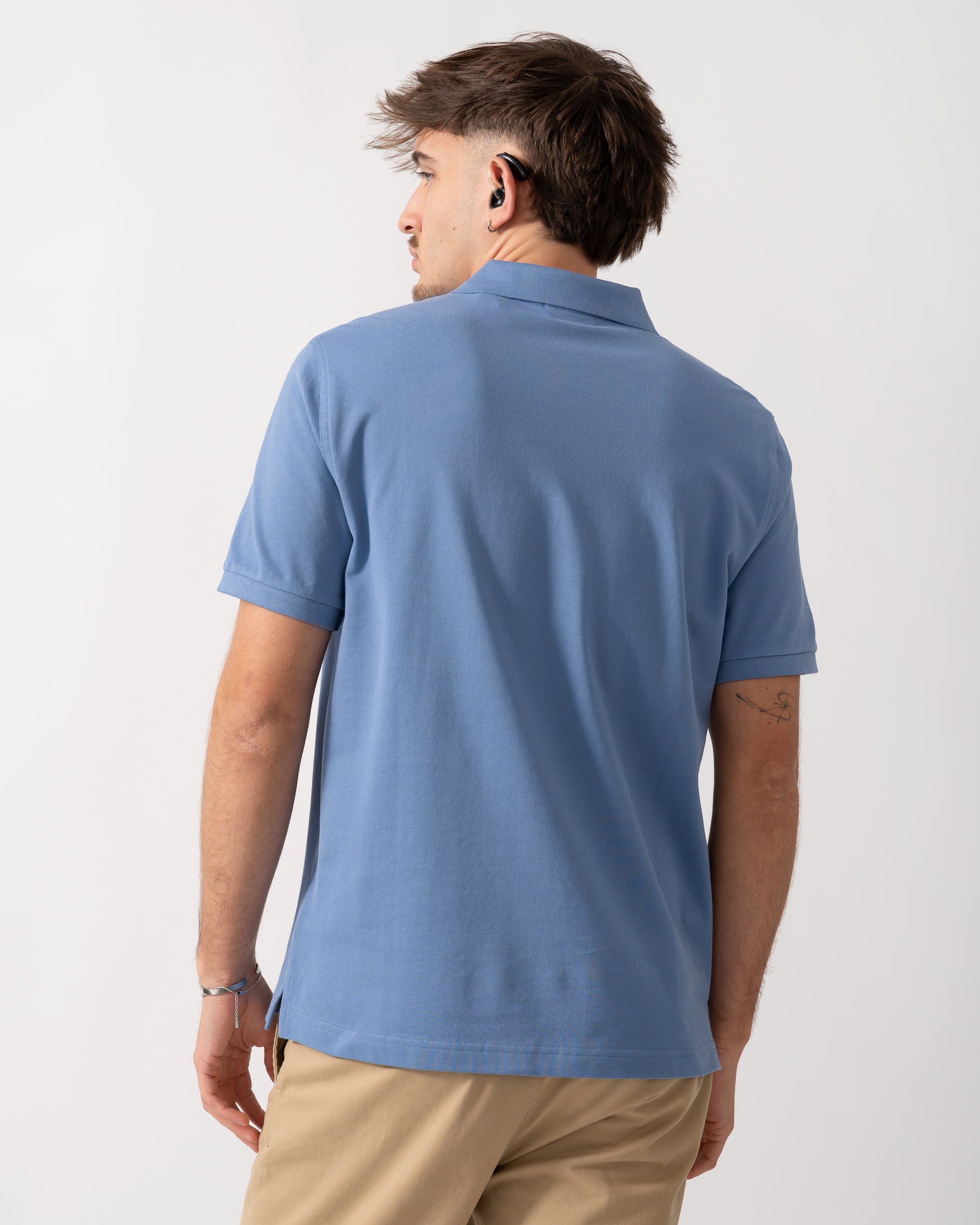 Back shot of a Model wearing a GANT Mens Regular Fit Short Sleeve Shield Logo Pique Polo in Faded Denim