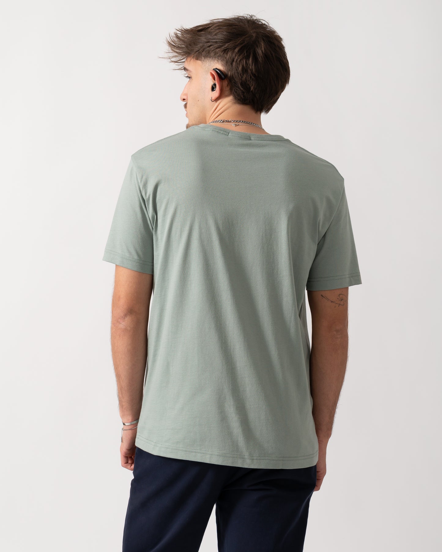 Back shot of a Model wearing a GANT Mens Regular Fit Short Sleeve Shield Logo T-Shirt in Ceramic Grey