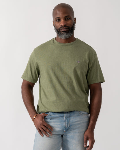 model wearing a GANT Mens Regular Fit Short Sleeve Shield Logo T-Shirt in Dark Cactus Melange