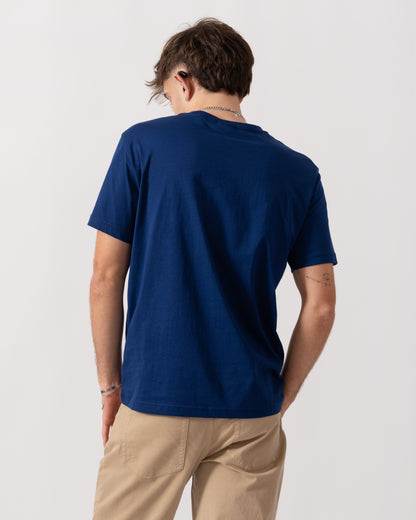 back shot of a model wearing a GANT Mens Regular Fit Short Sleeve Shield Logo T-Shirt in Rich Navy