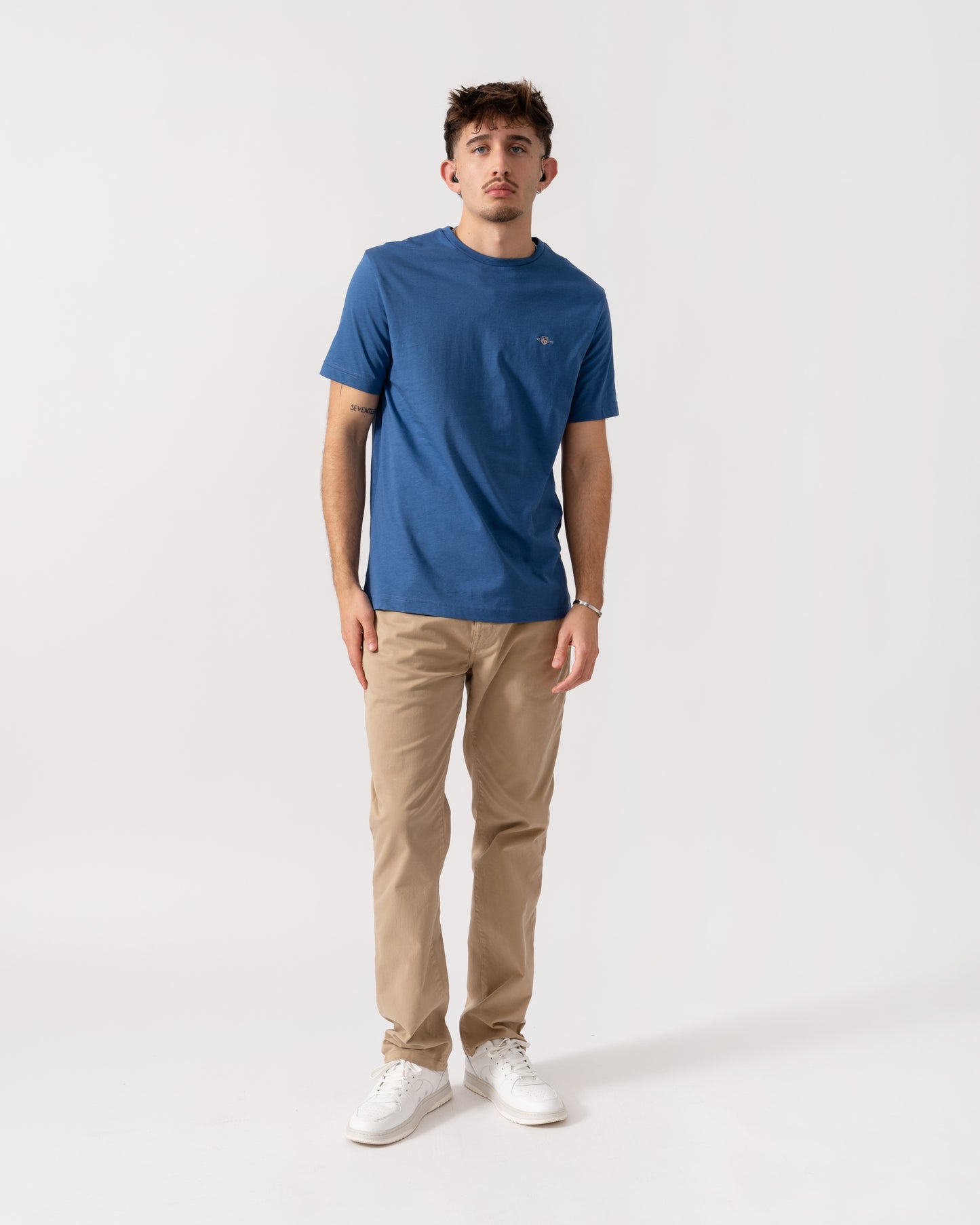 Full length shot of Model wearing a GANT Mens Regular Fit Short Sleeve Shield Logo T-Shirt in Vintage Blue