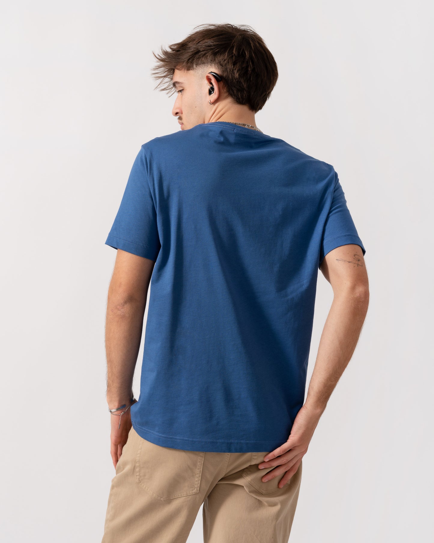 Back shot of Model wearing a GANT Mens Regular Fit Short Sleeve Shield Logo T-Shirt in Vintage Blue