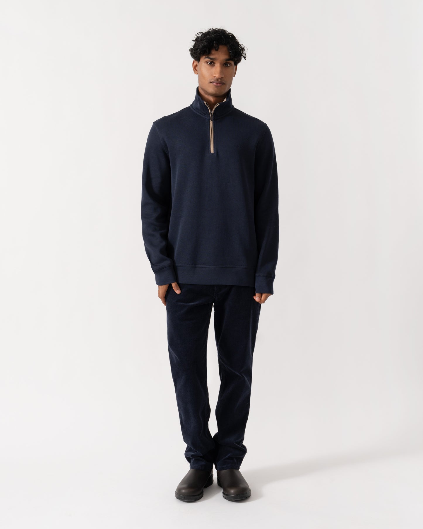 Man wearing GANT Mens Sacker Rib Half Zip Sweatshirt - 433 Evening Blue